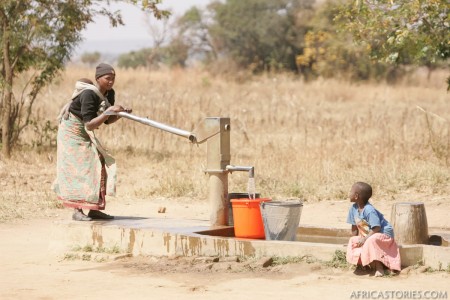 Woman Pumping Water