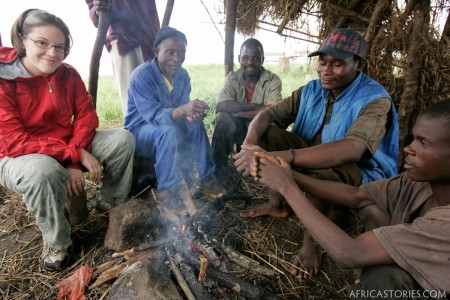 Rachel in hut with men on Zomba Plateau